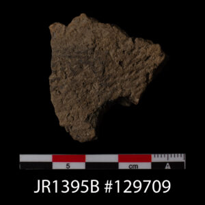 A sherd of Simple-Stamped Native ceramic. It is imprinted with a "Z" twist pattern on its exterior by a cord-wrapped paddle. This piece was found in Fort Pocahontas, the Confederate fort built partially overtop the remains of James Fort.