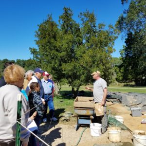 Archaeologist talking to visitors