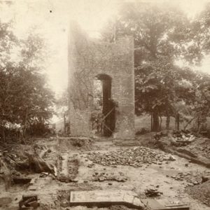 archaeological excavation in front of church tower ruins