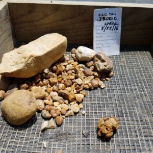 Rocks and cobbles in a screen