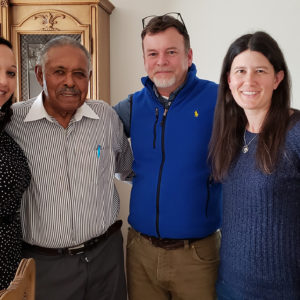 Archaeologists pose with interviewee