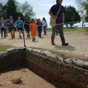 Archaeologist leading school group