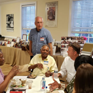 Dave Givens chats with Mr. Purcell Bailey and his wife Nellie after the community meeting