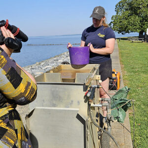 Curator Leah Stricker on the Seawall using the flotation machine.