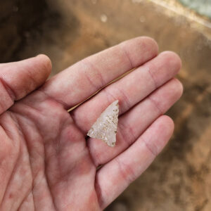 A quartz projectile point found during the excavations adjacent to the ticketing tent