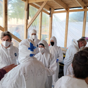 The team suits up prior to beginning the day's burial excavations.