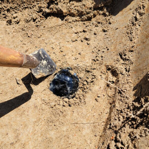 A glass bottle base found in the Smithfield excavations