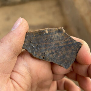 A burned ceramic sherd found in the excavations south of the Archaearium