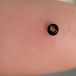 A tiny glass bead found by Archaeological Field Technician Josh Barber while sorting through objects from Pit 1.