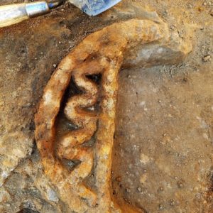 Trowel laying next to a griddle fragment in situ