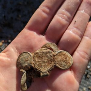 Six-part lead seal found in the midden layer of the Seawall excavations