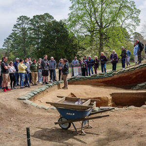 Archaeologist Hannah Barch gives a tour of the well and ditch excavations.