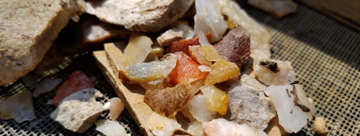 Assortment of lithic flakes in a screen