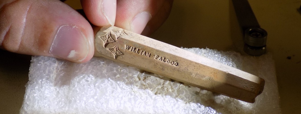 Pipe stem fragment stamped with name William Faldo