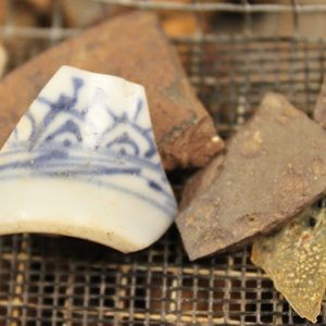 porcelain and assortment of other ceramic sherds in a screen