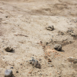 Top of an excavated feature with slag pieces in situ