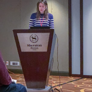 Woman presenting at a podium