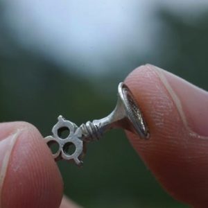 Side view of silver wax seal mold with scallop shell design