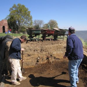 Two archaeologists excavating