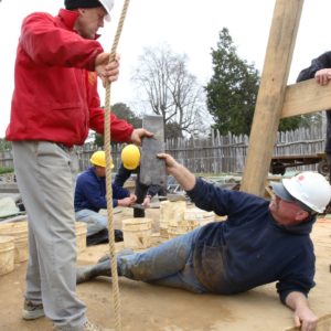 Archaeologists pass artifact up from well