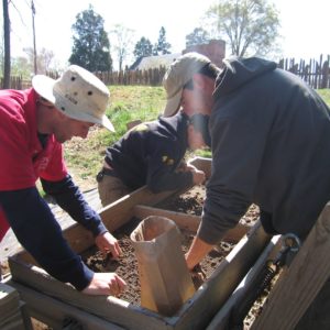 Archaeologists screen for artifacts