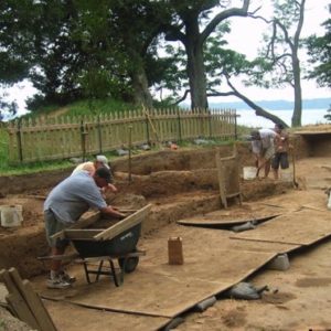 Archaeologists screening artifacts