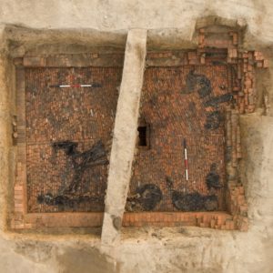 Aerial view of excavated brick-lined cellar