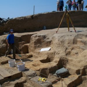 Archaeologist standing in excavated cellar