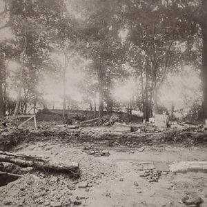 Black-and-white photograph of churchyard excavations