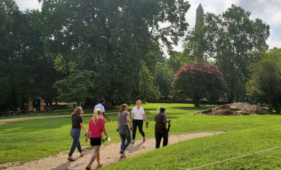 Leah leads a group of DAACS attendees across the site