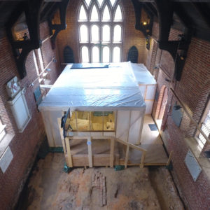 Protective tent inside brick church