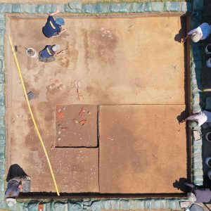 A drone shot of the cellar excavations. The 5' x 5' excavation square from 1995 is near the center. The yellow conduit houses fiber optic cable providing the Memorial Church with an Internet connection.