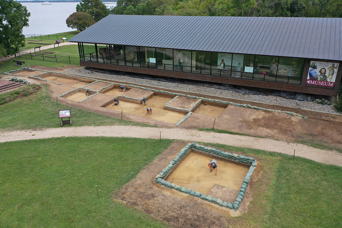 The excavations just south of the Archaearium. The burial slated for excavation is being scored by Archaeological Field Technician Josh Barber at the bottom of the photo.