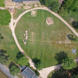 A drone shot of the first five excavation squares in Smithfield. A bit of the Archaearium museum can be seen at the top of the photo. The Dale House is at bottom. The barracks excavation can be seen near the bottom right of the photo, covered with a tarp.