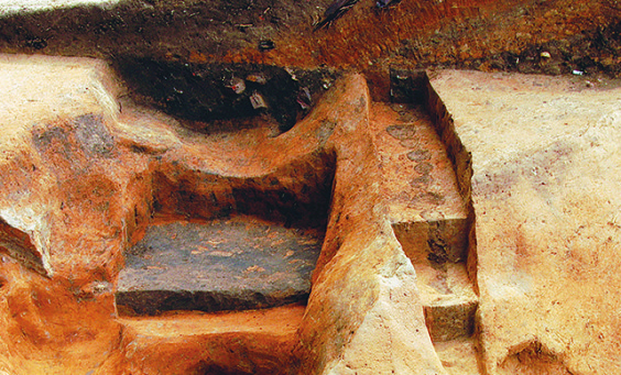 Archaeologist examines excavations