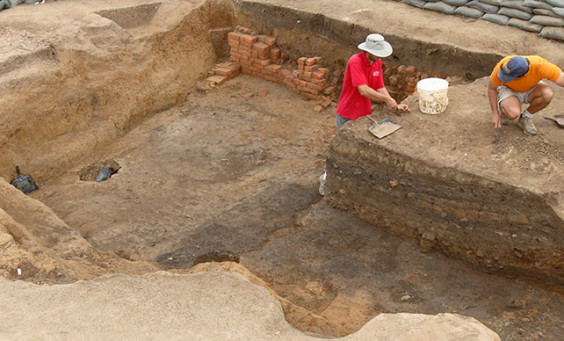 Archaeologists excavating cellar