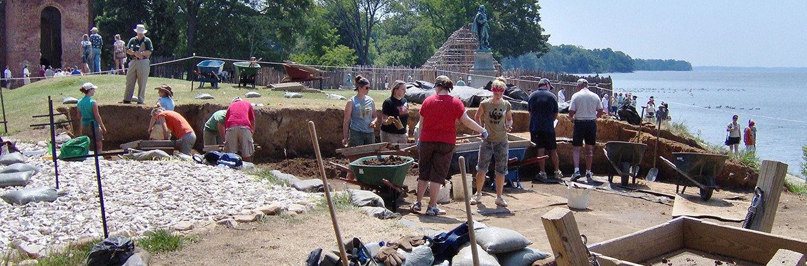 Archaeologists and students excavating