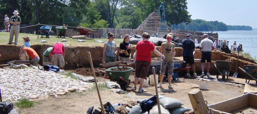 Archaeologists and students excavating