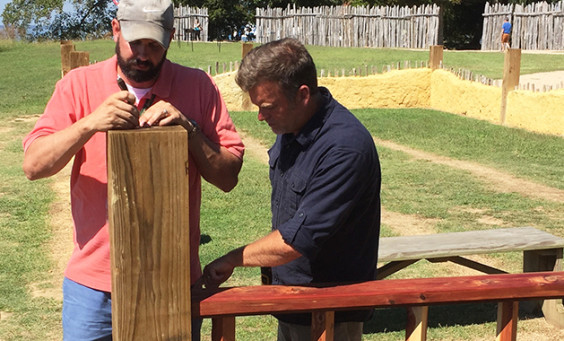 Archaeologists noting measurements of church reconstruction