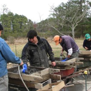 Archaeologists screening artifacts