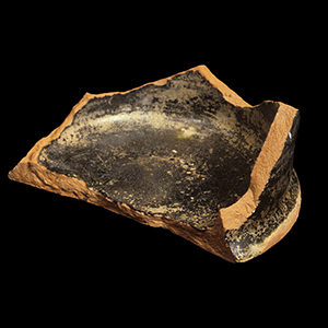 Earthenware base sherd with black glaze