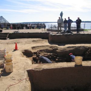 Small group watches archaeologists excavating