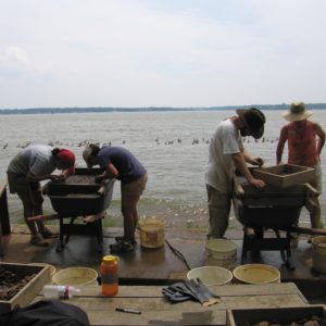 Groups screen for artifacts on a riverbank