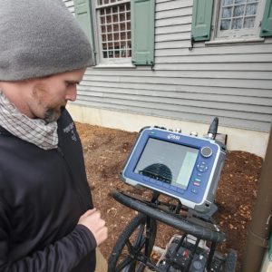 Archaeologist Gabriel Brown performs a GPR survey in the Ellen Kelso Memorial Garden.