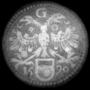 x-ray of a token displaying a double-headed eagle