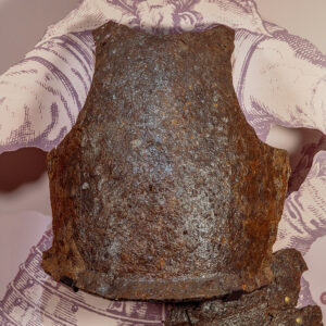 The 15th-century breastplate in the Archaearium before undergoing additional conservation.