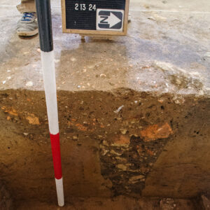 A posthole found during the Church Tower excavations that was filled with brick and mortar rubble. This cut the ashen feature seen just to the west which was probably part of the remains of the wood framed tower burned during Bacon's Rebellion (1676). This posthole was in turn cut by the Church Tower's (1680s) builder's trench so the feature has a rather tight timeframe.