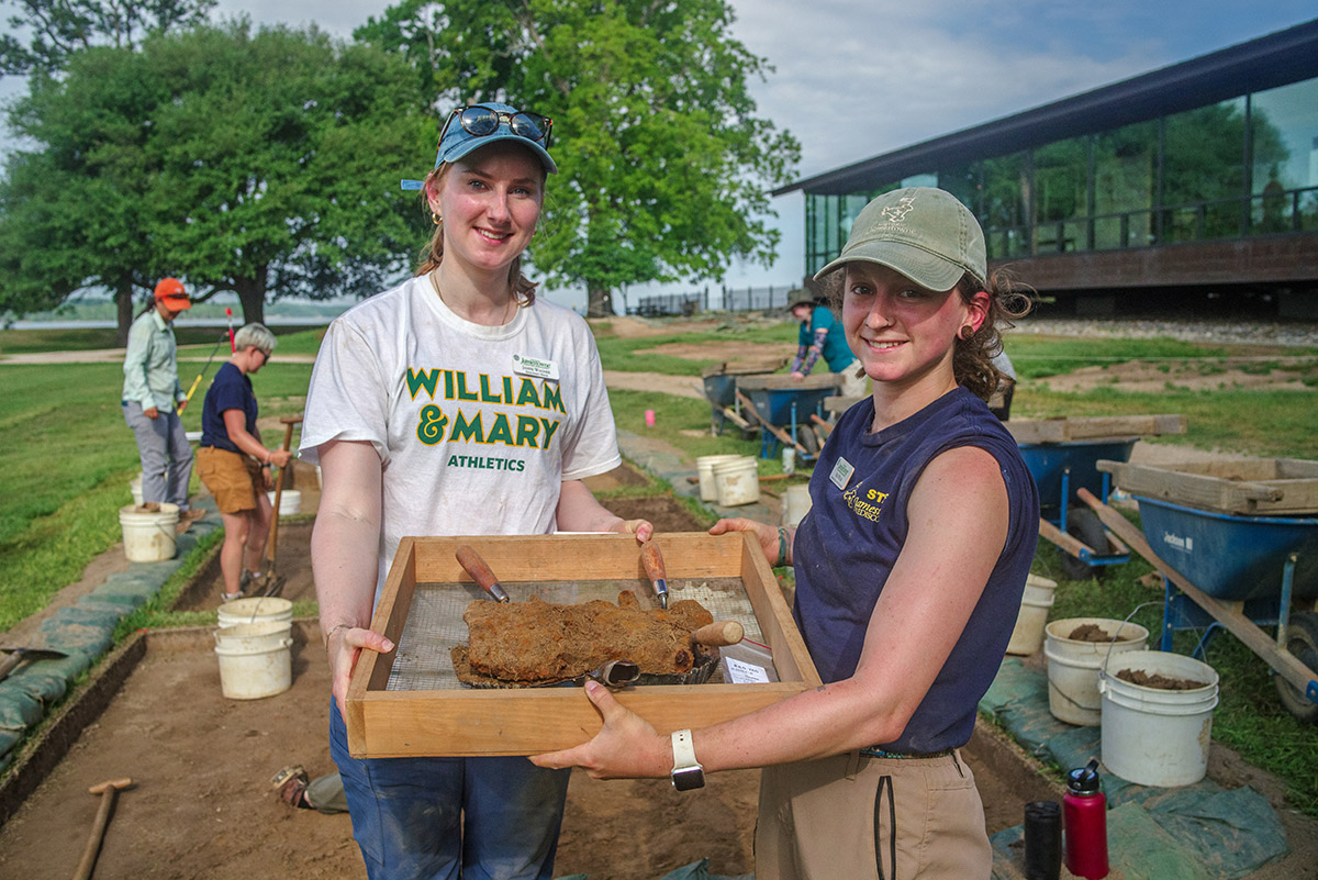 Development Writer Janne Wagner and Archaeological Field Technician Ren Willis hold the UFO (Unidentified Ferrous Object) the pair excavated during one of the staff dig days. The two were both students in 2023's Field School.