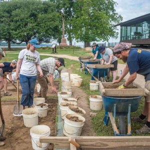 During one of the staff dig days archaeologists and other Jamestown Rediscovery staff excavate squares just south of the Archaearium.