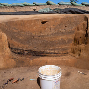 A profile of the 1608 ditch as seen from the well. Wash layers and charcoal are visible.